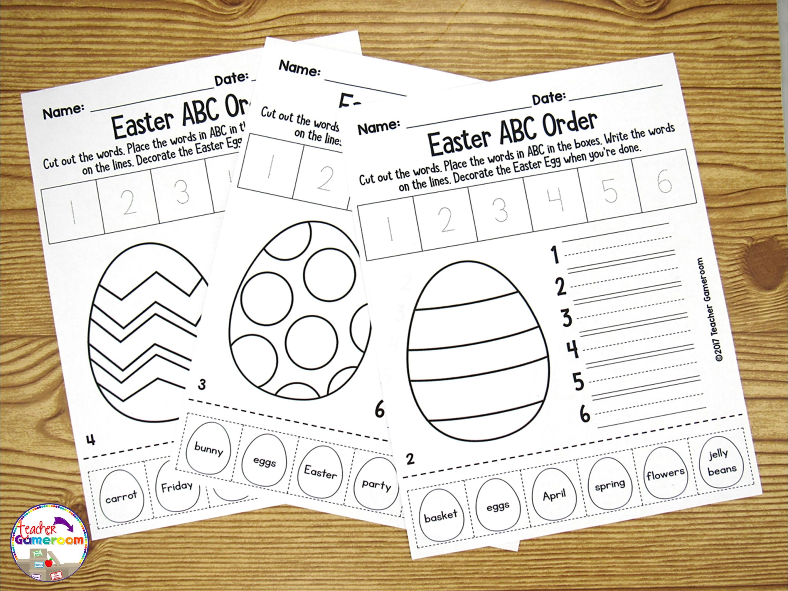 3 Easter ABC Order Worksheets on a desk